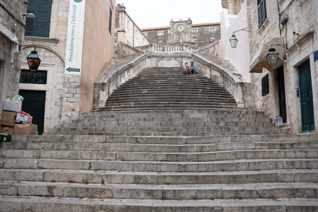 Dubrovnik, Croatia - 8 July 2022: Tourists on Jesuit stone stairs in old townのeditorial素材