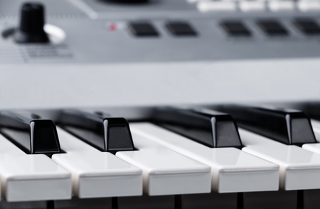 Fragment of electronic synthesizer keyboard with control buttonsの写真素材