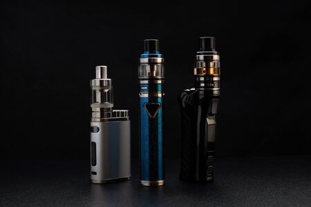 Electronic cigarettes or vaping devices on blackの写真素材