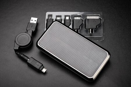 External battery for mobile devices and universal adapters for charger. Concept of energy storage...