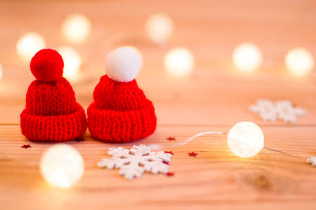 Two red hats and a snowflake. Winter.の写真素材