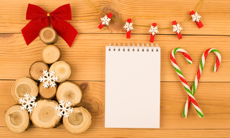 Wooden Christmas tree with bow and snowflakes.の写真素材