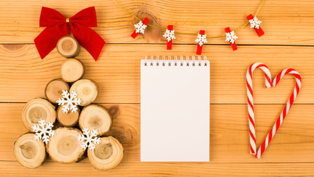 Wooden Christmas tree, notebook and candy heart.の写真素材