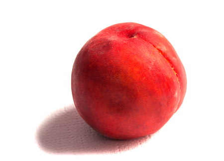 Ripe red peache on a white background in a row close-up.の写真素材