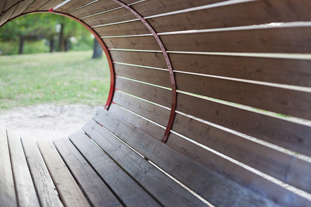 Barrel shaped structure made of planks at the playground.の写真素材