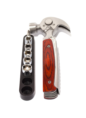 Set of screwdrivers for small screws and hammer close-up. Isolated background.