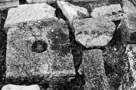 Stones and pieces of white marble,part ancient building.