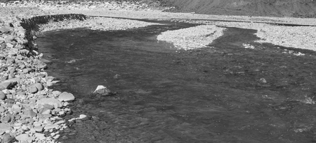  River stones in the water of a small mountain stream.