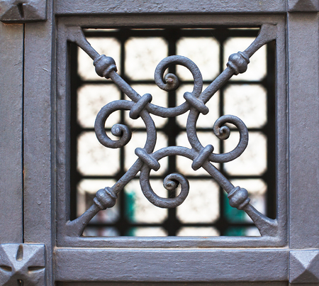 Detail of a beautiful iron fence carved close-up.の写真素材