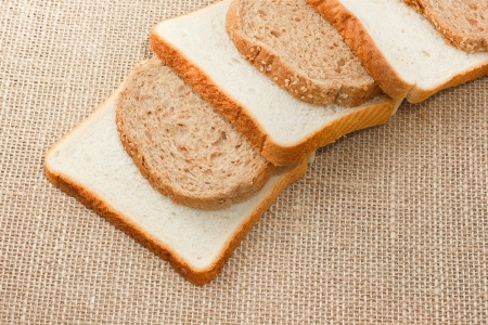 sliced bread on sacking backgroundの写真素材