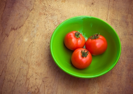 Healthy fresh vegetables ingredients for cooking in rustic setting: tomatoes, garlic, spices, chili. pepperの写真素材