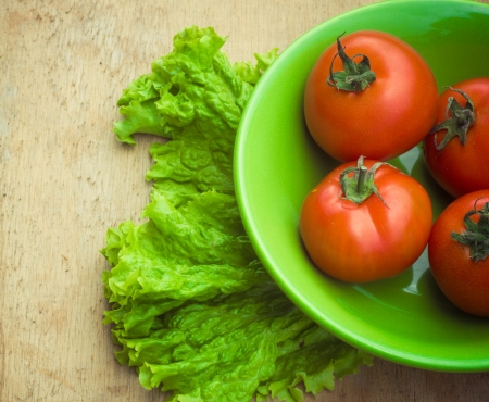 Healthy fresh vegetables ingredients for cooking in rustic setting: tomatoes, garlic, spices, chili. pepperの写真素材