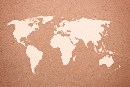 Photo of world map on natural brown recycled paperの写真素材