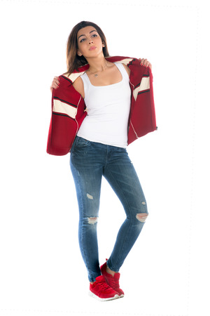 Girl posing in jeans white backgroundの写真素材