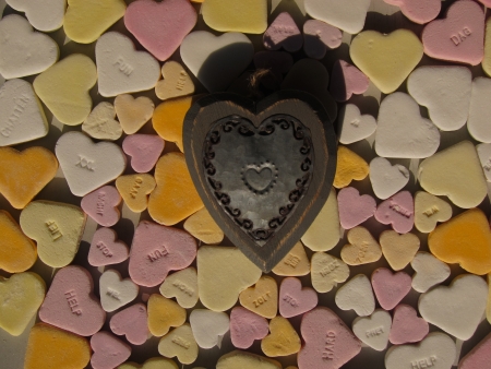 Heartshaped candy hearts with wooden metal heart