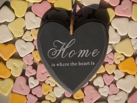 Heartshaped candy hearts with wooden heartの写真素材