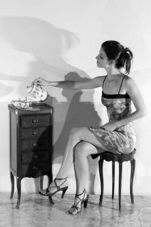 Pretty young brunette girl in the roomの写真素材