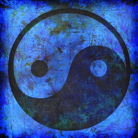 yin and yang symbol on blue background grungeの写真素材