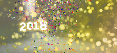 happy new year 2018 greeting card design with colorful confetti, bokeh light shapes and copy spaceの写真素材
