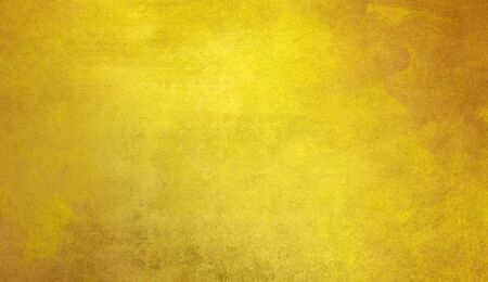 gold paint glazes in different shifting shades on paper structureの写真素材