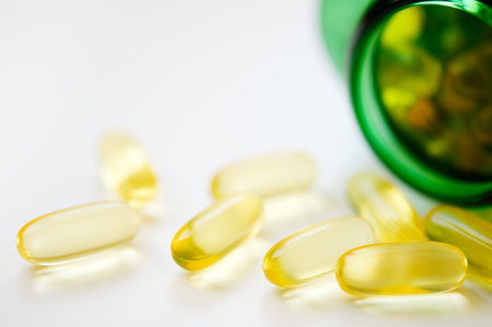Fish oil capsules. Selective focus and shallow depth of field.の写真素材