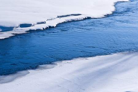 River water freezing on a very cold winter day.の写真素材