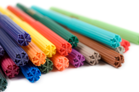 Bunch of colored felt tip pens isolated on white background. Focus on foreground pens.の写真素材