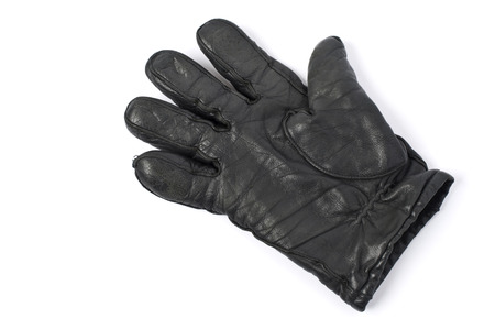 Black leather glove on white background.の写真素材