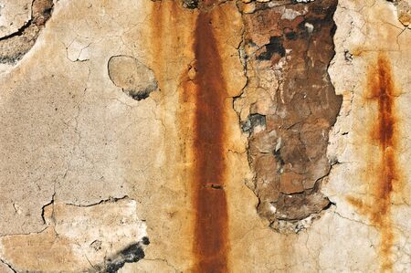 Old cracked and weathered concrete wall.