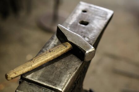 Anvil and hammer, blacksmith tools in the forgeの写真素材