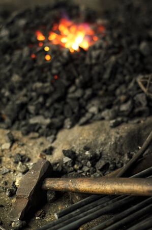 Close-up of blacksmithâs hammer and forgeの写真素材