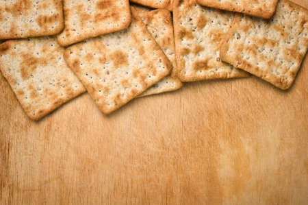 Crackers on wooden background.の写真素材
