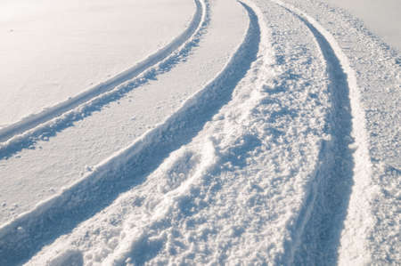 Tire tracks in snowの写真素材