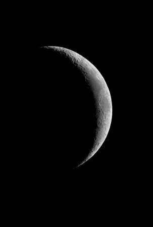Crescent Moon with crater detail.の写真素材