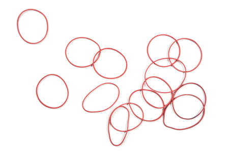 Red rubber bands on white background.の写真素材