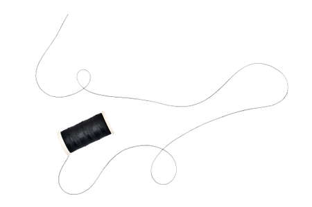 Spool of sewing thread on white background.の写真素材
