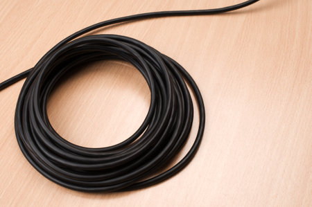 Electric cable on wooden table.の写真素材