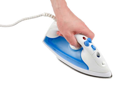 An electric steam iron in hand. Isolated on white.