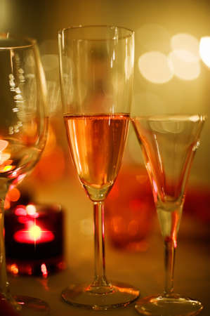 Champagne and wine glasses on the table. Selective soft focus and shallow depth of field.の写真素材