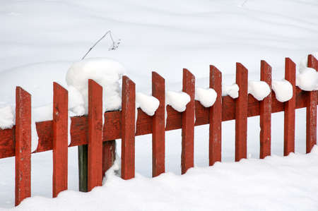 Picket fence in snowの写真素材