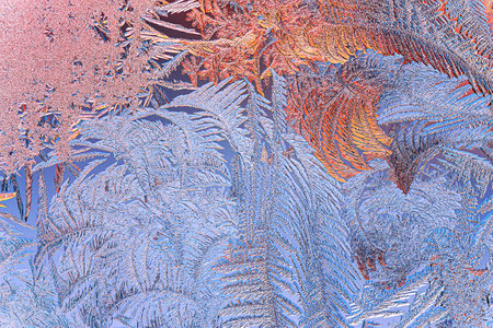 Winter Icy and Frosty Patterns on the Window Glass.  Background for Christmas and New Year. Macro...