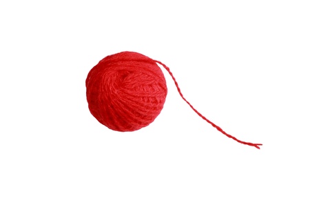a red ball of yarn for knitting on a white backgroundの写真素材