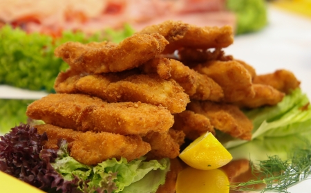 Fried fish fillets with vegetablesの写真素材