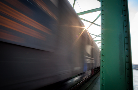 Close up picture of freight train in motion on bridgeの写真素材
