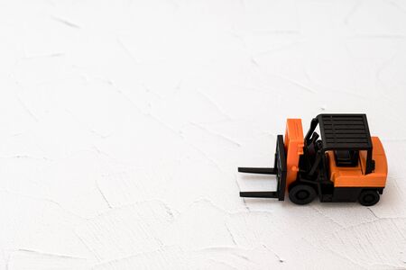 Toy forklift taken on white background