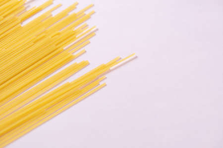 Long pasta with pink backgroundの写真素材