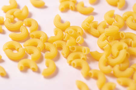 Short pasta with pink background