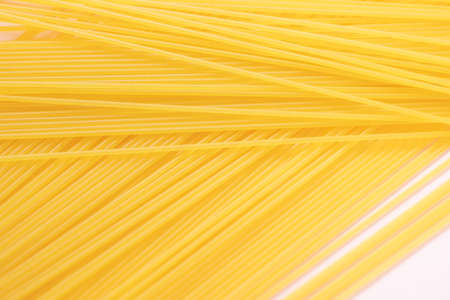 Long pasta with pink backgroundの写真素材