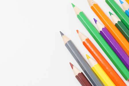 Colorful colored pencils placed on a white backgroundの写真素材