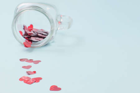 Numerous red hearts with glass bottles with blue backgroundsの写真素材